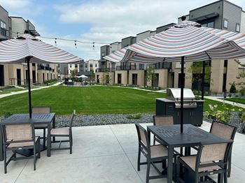 Patio with chairs and umbrellas